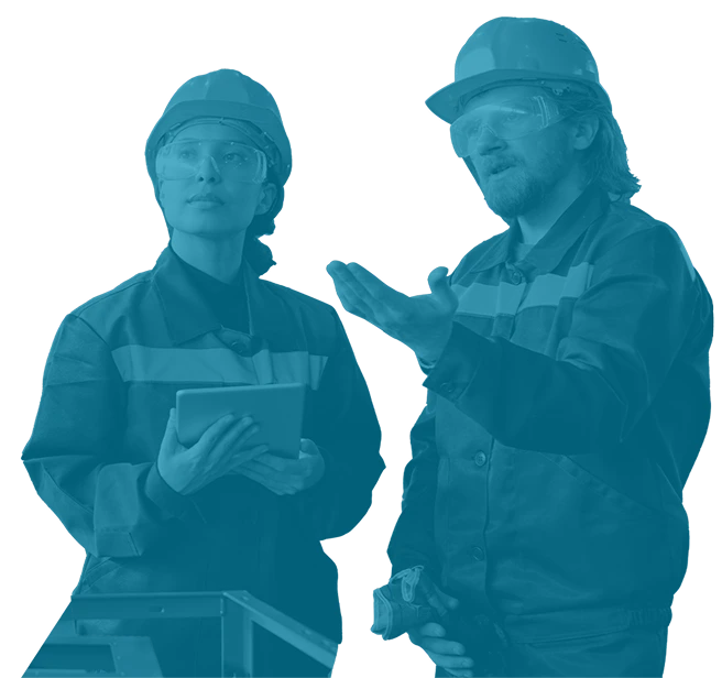 Two maintenance leaders discussing operations on the plant floor—featured in Reliability Academy’s LC100 course on leadership and culture in reliability improvement